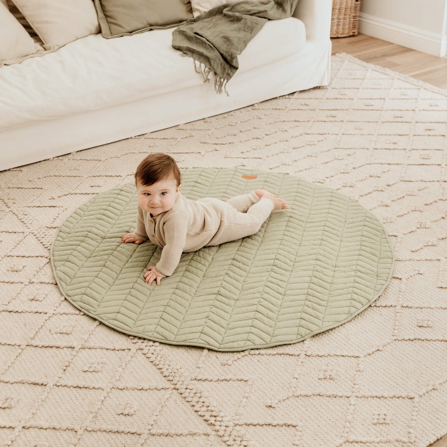 Tummy time on sage linen play mat