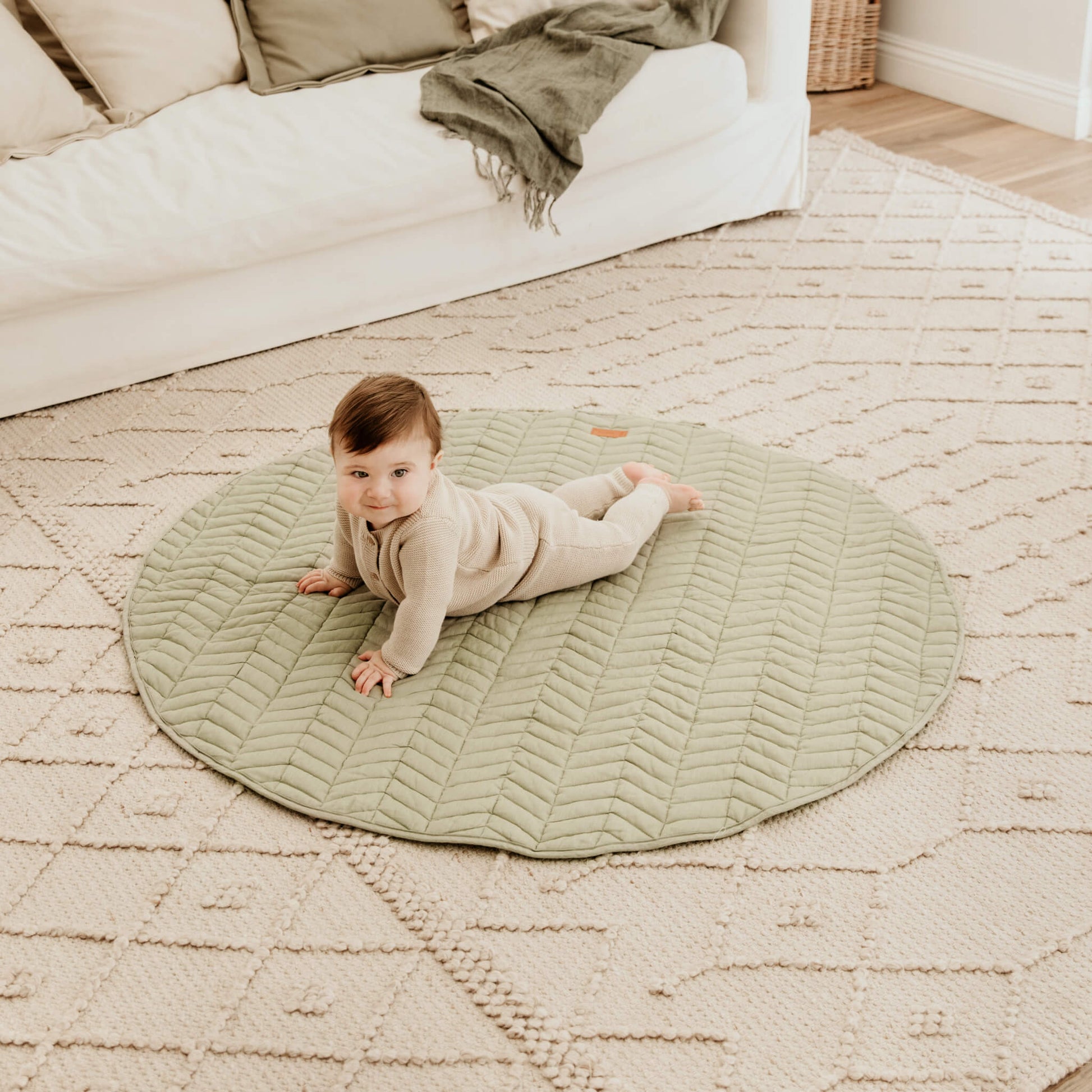 Tummy time on sage linen play mat